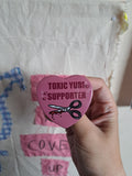 Toxic Yuri heart badge